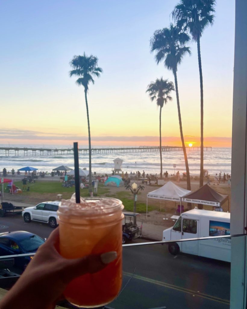 cocktail overlooking beach and sunset in ocean beach