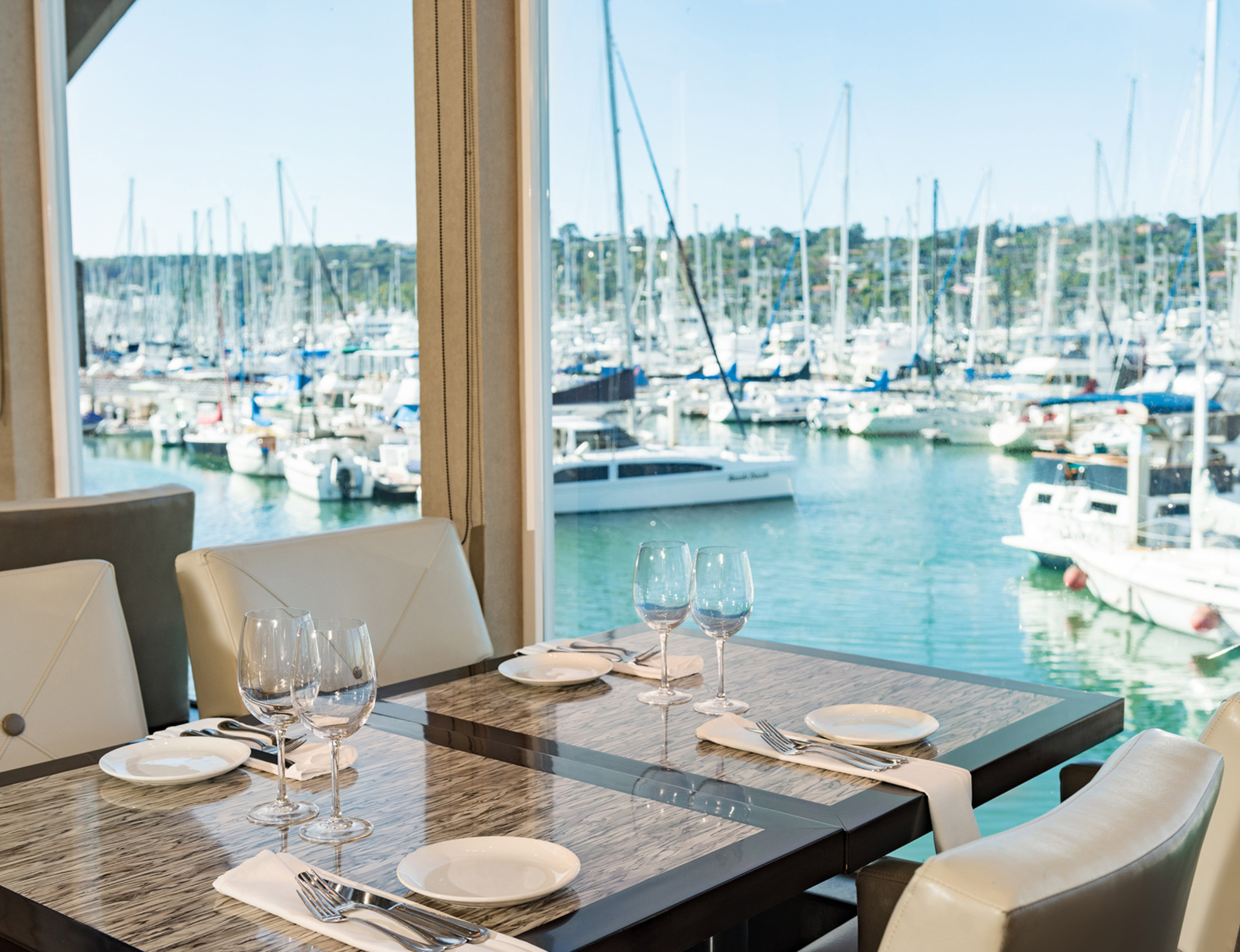 a dining table overlooking the water