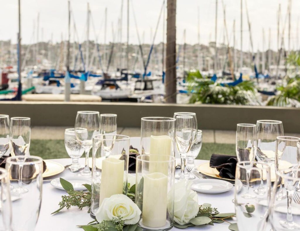 Dressed table overlooking boats on the marina