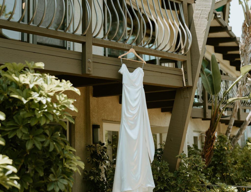 wedding dress hanging on a balcony