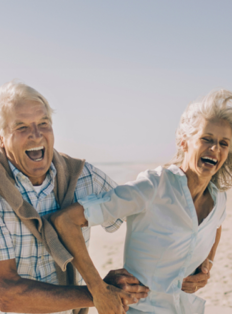 Two elderly people having fun