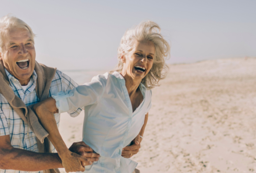 Two elderly people having fun