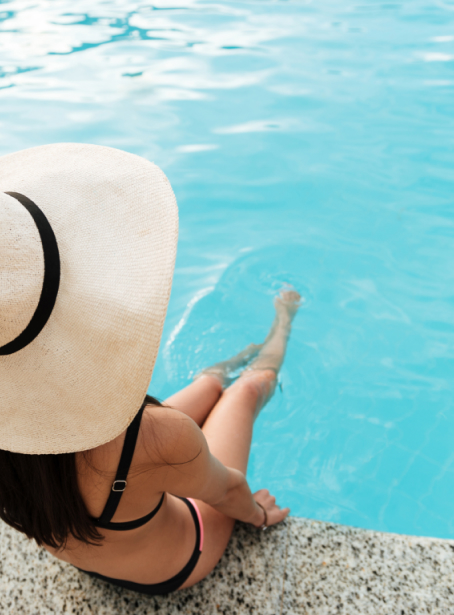 Woman soaking their legs in the pool