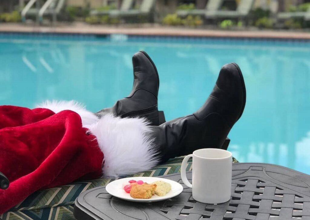 Santa lounging by the pool