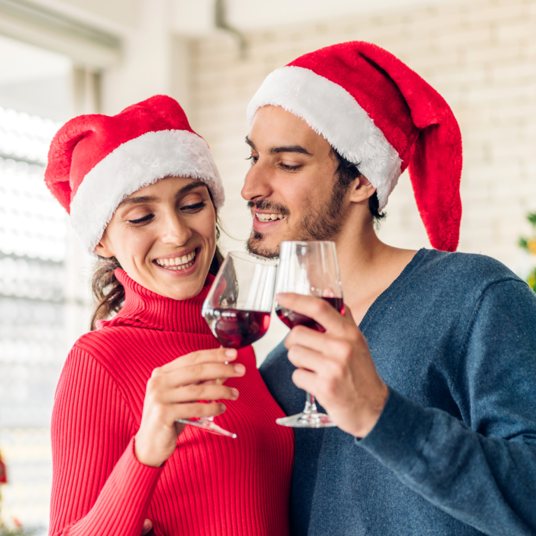 a couple wearing Santa hats