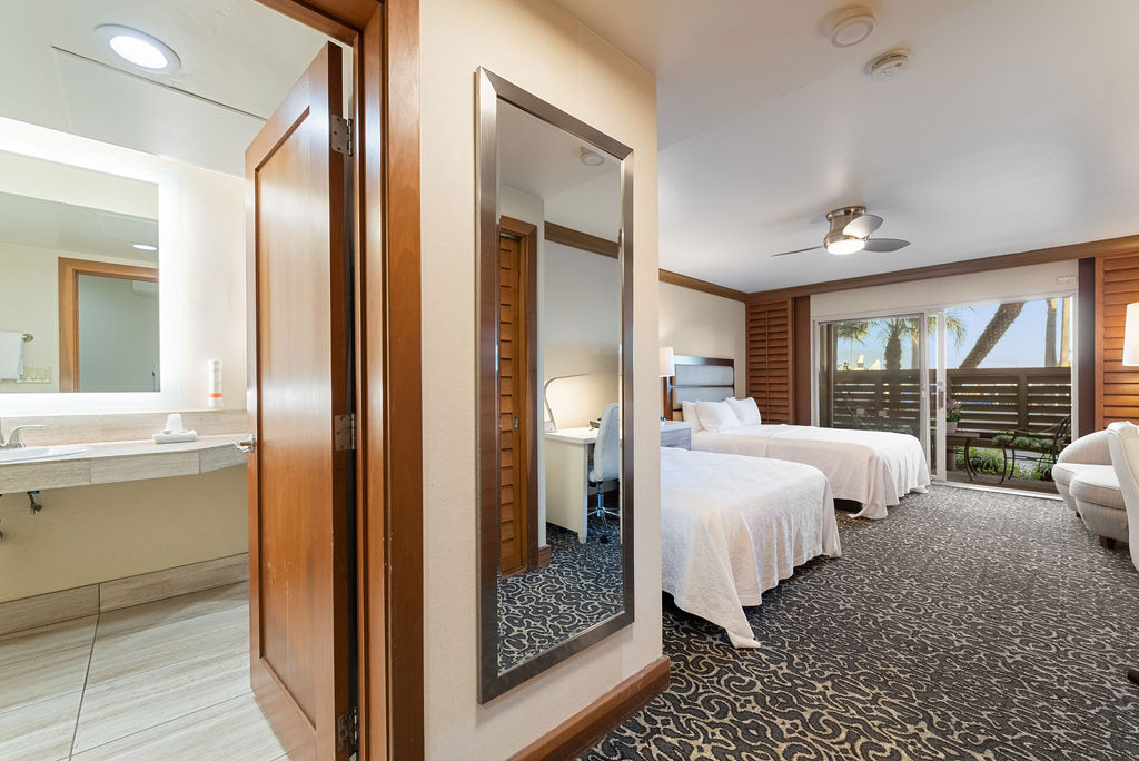 Queen bedroom with view out towards balcony