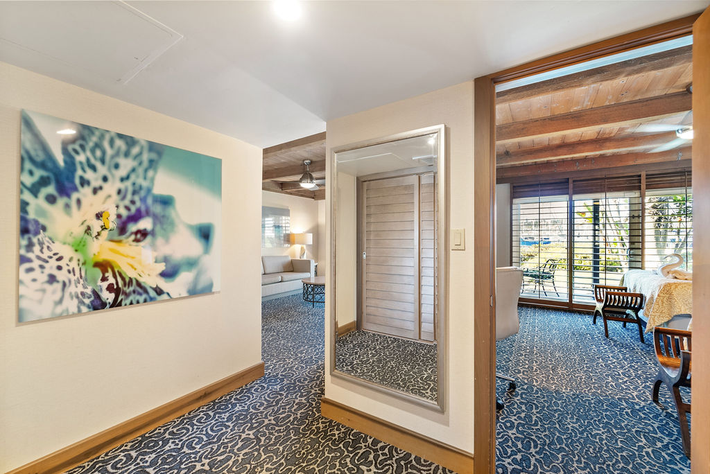 Hallway Mirror with view of bedroom through the door