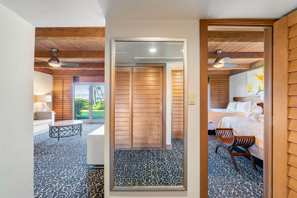 Hallway Mirror with view of living room and bedroom