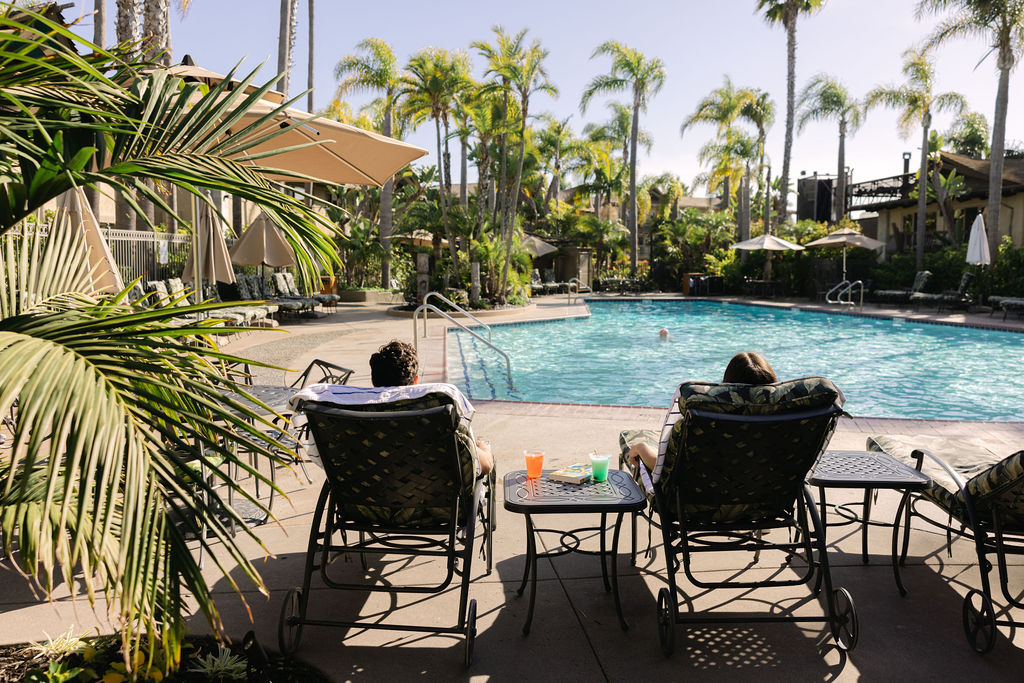 couple relaxing by the pool San Diego