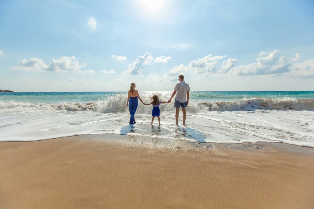 family on beach in san diego
