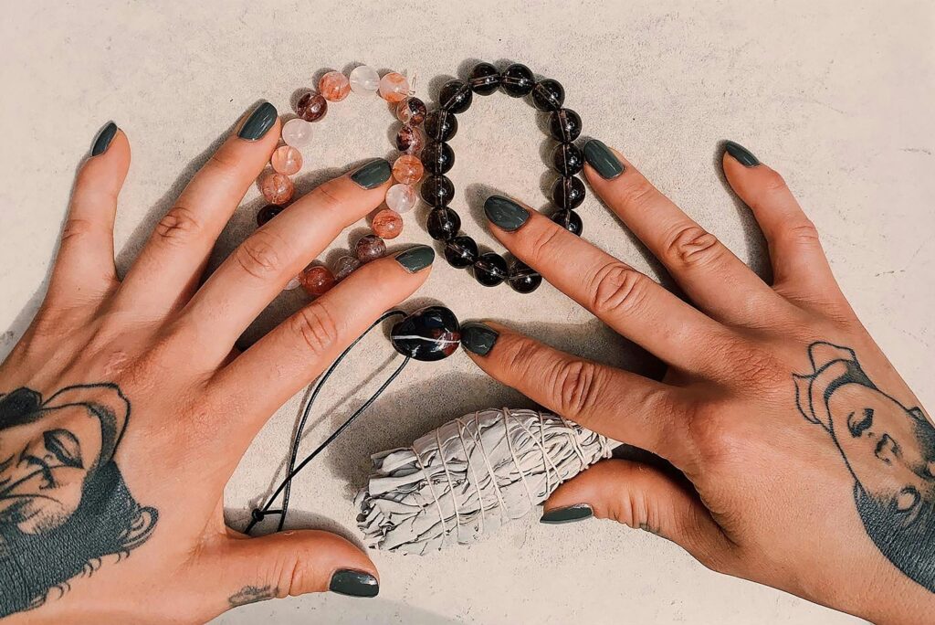 hands with crystal jewelry