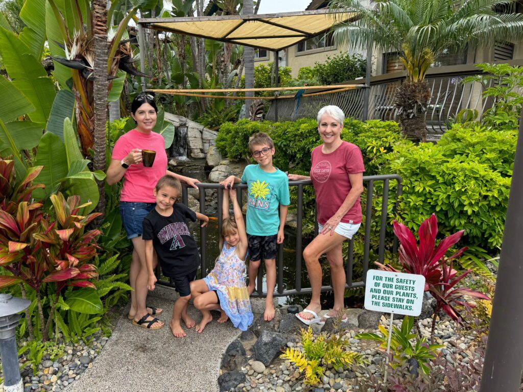 family standing in front of birds
