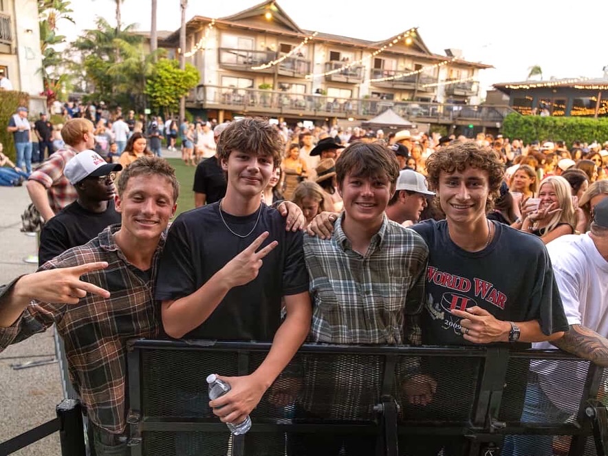 people standing in front of concert