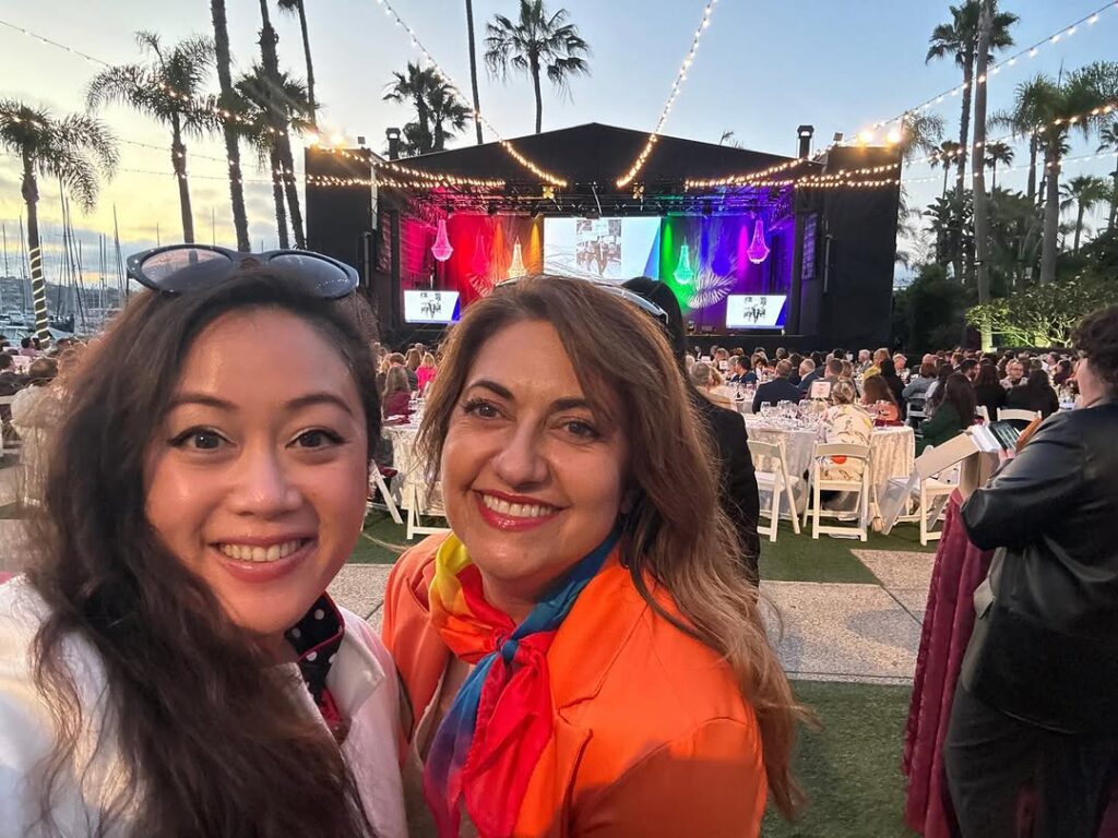 girls taking photo at concert venue