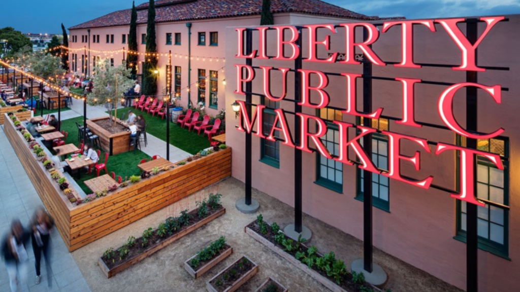 The Liberty Public Market Sign in front of a building