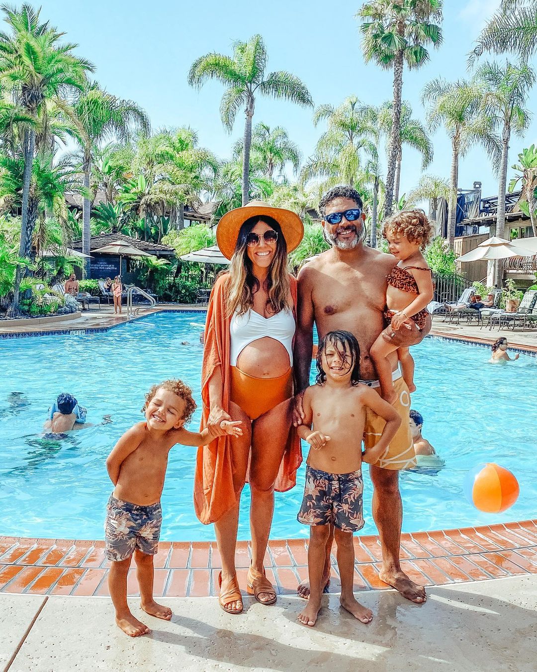 Family Standing in front of pool