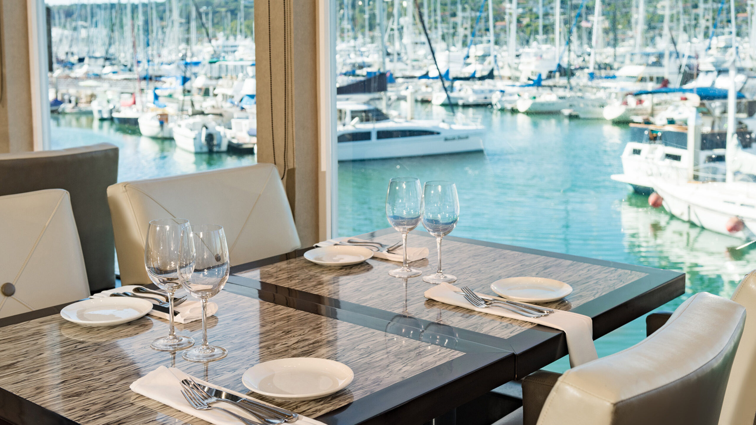 a dining table overlooking the water